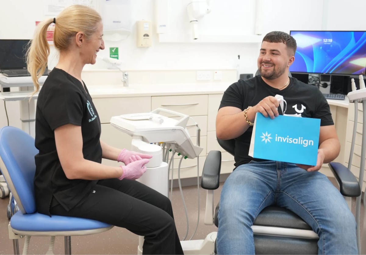 Patient discussing Invisalign treatment with a clinician at Kington Dental